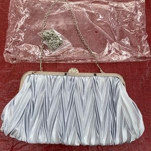 NWOT. Silver silky clutch
